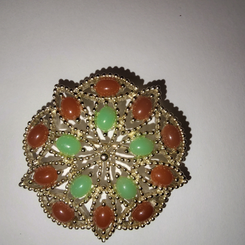 Elegant Gold and Green Brooch